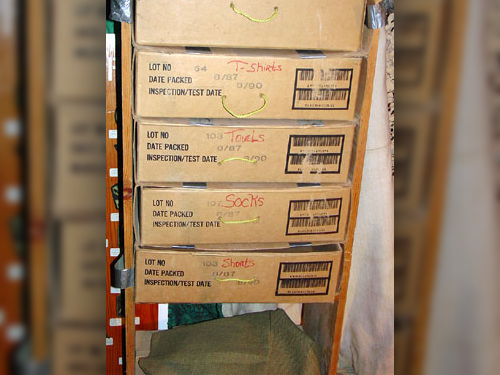 A chest of drawers crafted by Captain Larry Houck, made of scavenged wood, MRE boxes, and duct tape.