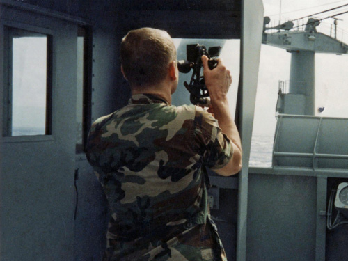 Soldiers using a sextant for celestial navigation.