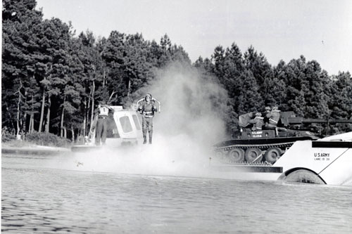 Combat Readiness Demonstration of the Rocket Belt at McKellar’s Pond on Ft. Bragg, NC in 1961.  The Rocket belt is being launched from a LARC XV 3X in preparation for a demonstration to   President Kennedy.  The original Army rocket belt is on display at the U.S. Transportation Museum.