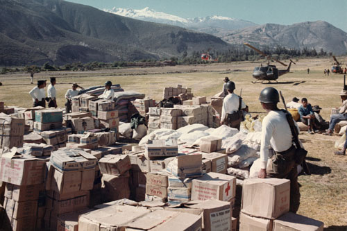 Earthquake Relief : Peruvian Soldiers guard relief supplies brought in by US Army UH-1Ds in June of 1970.  Part of the research collection of the U.S. Army Transportation Museum.