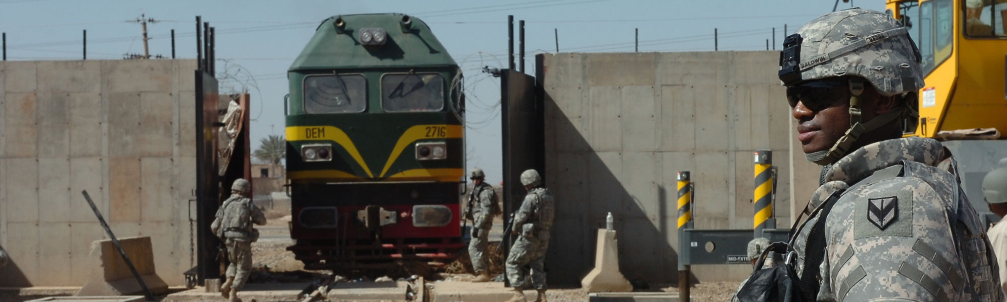 MAJ Baldwin, the mobility chief for the 1st Sustainment Brigade, looks on as Soldiers from 2nd Battalion, 11th Field Artillery Regiment opened the rail gates at Camp Taji from Baghdad on 10 March 2008. US Army Image.